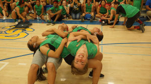 The senior’s human table struggles to keep from collapsing. 