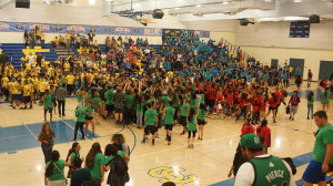 The seniors swarm to the center of the gym to huddle and celebrate their victory in 2015’s BOTC.