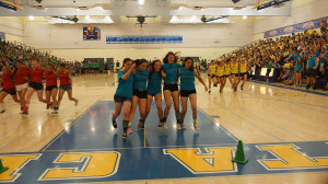The sophomore girls' 5-Legged Race team bolts to the other side of the gym. 