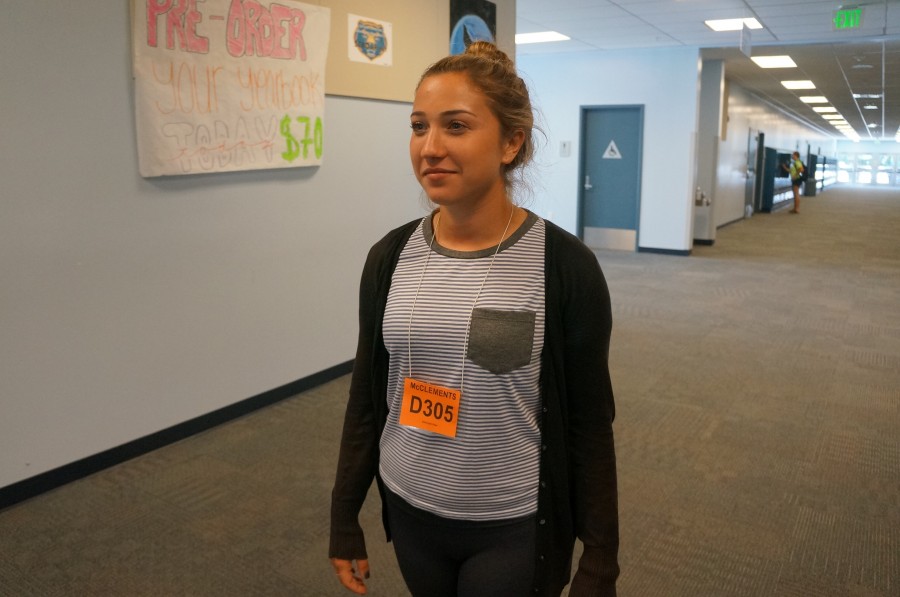 Junior Haley Levene walks to down the D-wing to the closest restroom, with the color-coded pass around her neck.