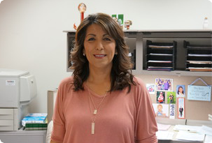 School registrar Lisa Mendez listens to Mr. Worldwide