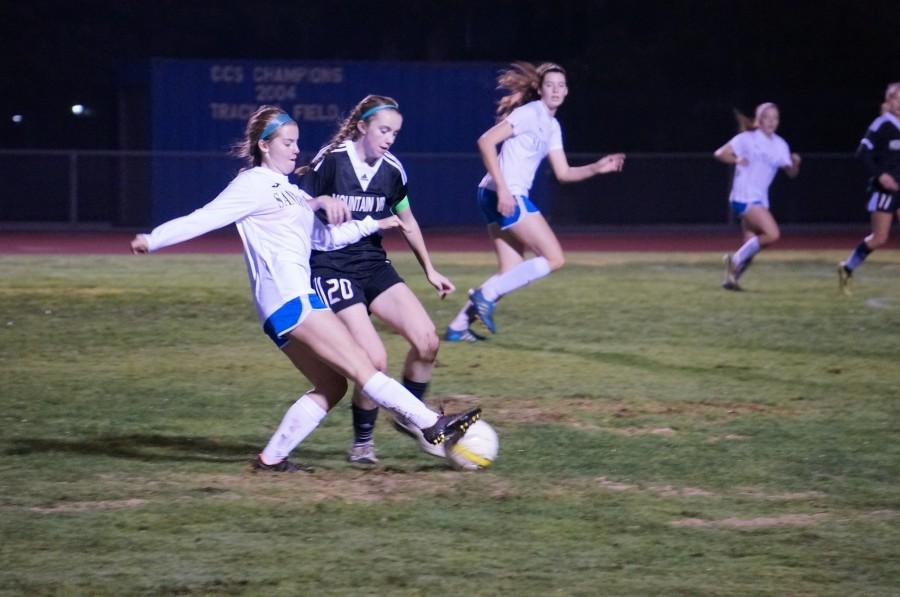 Maddie Ambelang battles for possession of the ball.