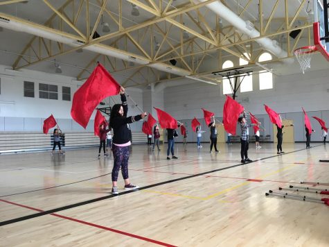 SCHS’s colorguard team assists Buchser Middle School students in an after-school colorguard program
