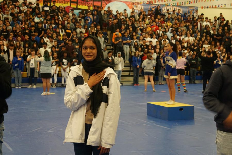 Sophomore Saahar Khan signs the National Anthem in American Sign Language. 