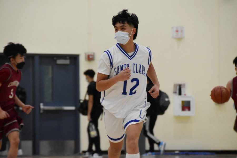 Senior Jason Visitacion plays at the varsity boys basketball game against Cupertino on Feb. 1, 2022, with new COVID-19 restrictions in place.