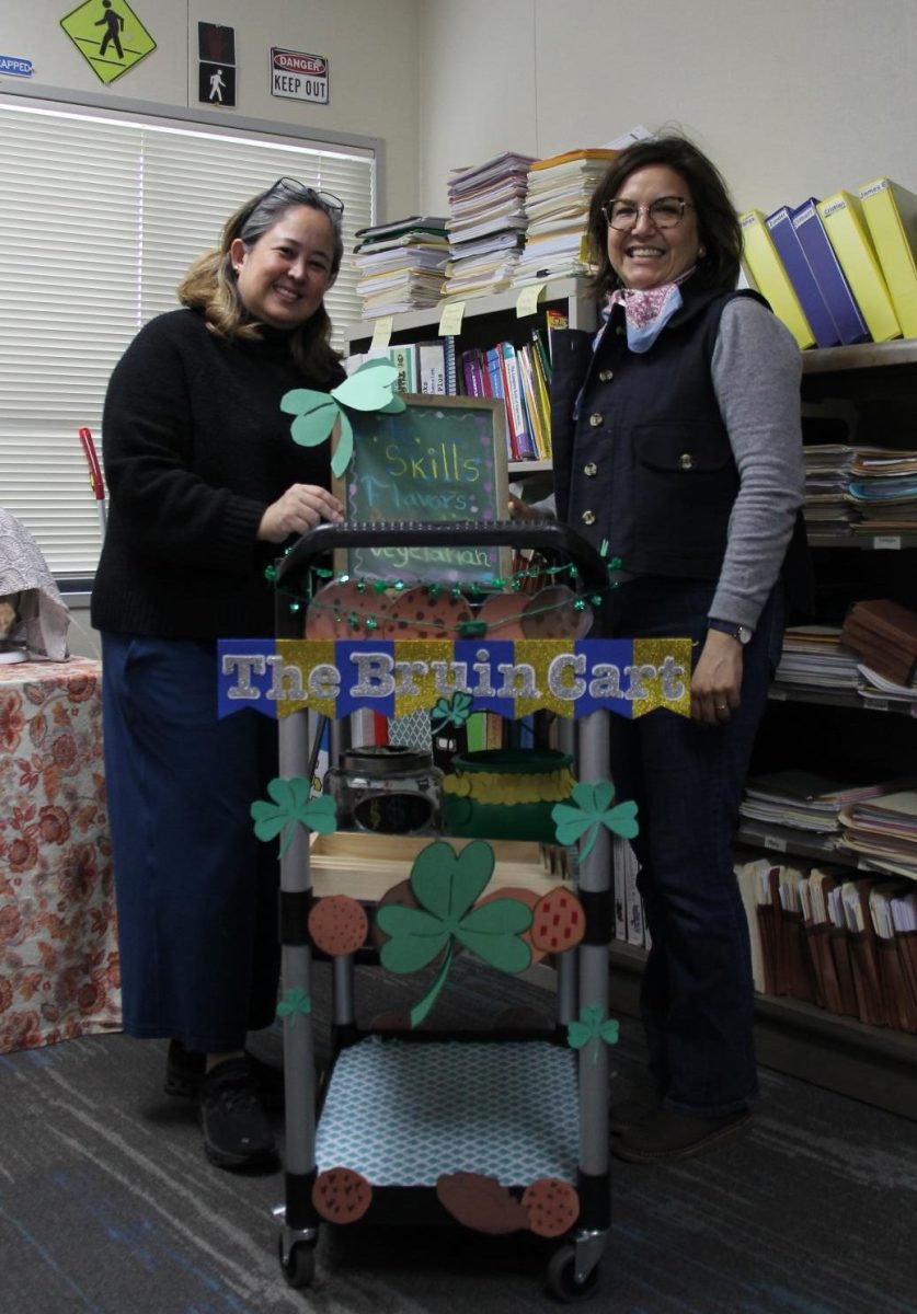 Practical life skills teacher Cris Syquia and paraeducator Elvira Martin help students run the Bruin Cart.