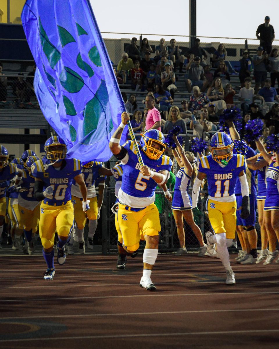 The SCHS Football team runs out of the tunnel at Santa Clara High School on Sep. 6, 2024.
