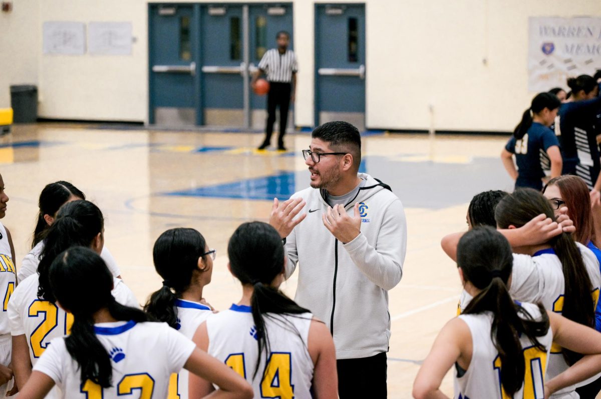 Coach Saheed Mohamed advises his players during the Warren Johnson Memorial tournament.