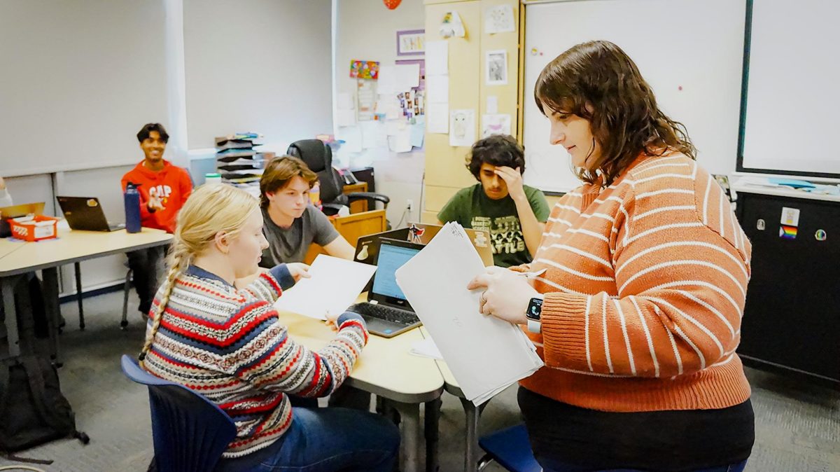 English teacher Theresa Shaw-Iyer interacts with her students.