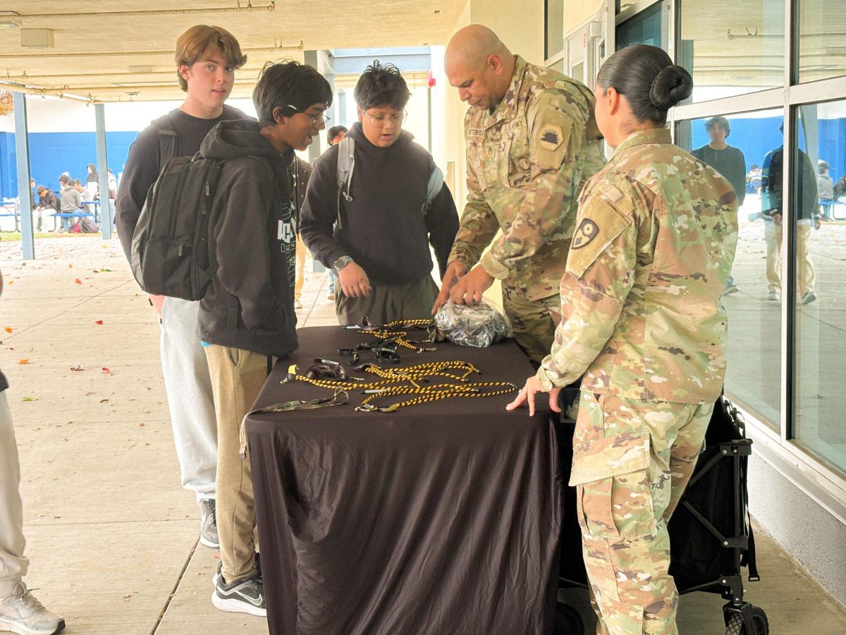 Students experience military recruitment through booths in front of the cafeteria.