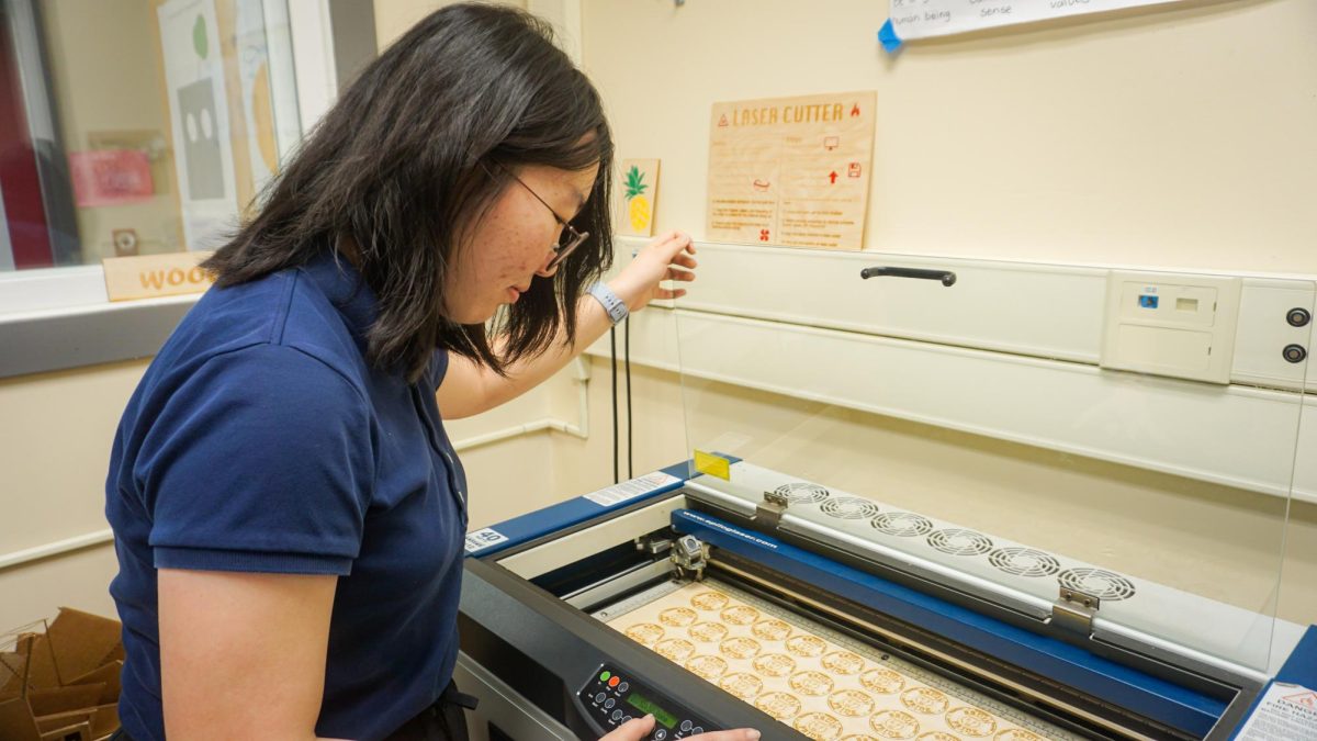 Junior Jean Yoo utilizes one of the Fab Lab’s laser cutters to assist her with personal projects and school assignments.