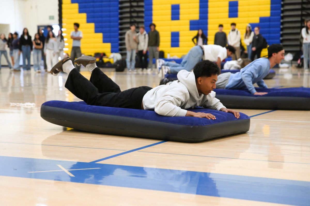 Junior Andrew Catolico practices for the Mattress Race, one of BOTC’s newly introduced events.