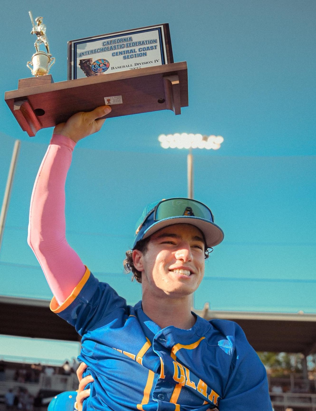 Senior Connor Houle holds up the Bruins' CCS Trophy.