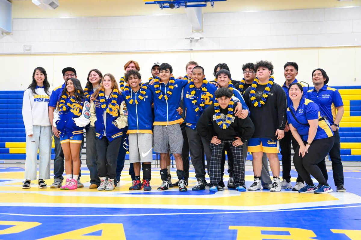 Assistant coaches on the SCHS wrestling team often form closer bonds with athletes since they have more opportunities to work with them one-on-one during practice with specialized training. 