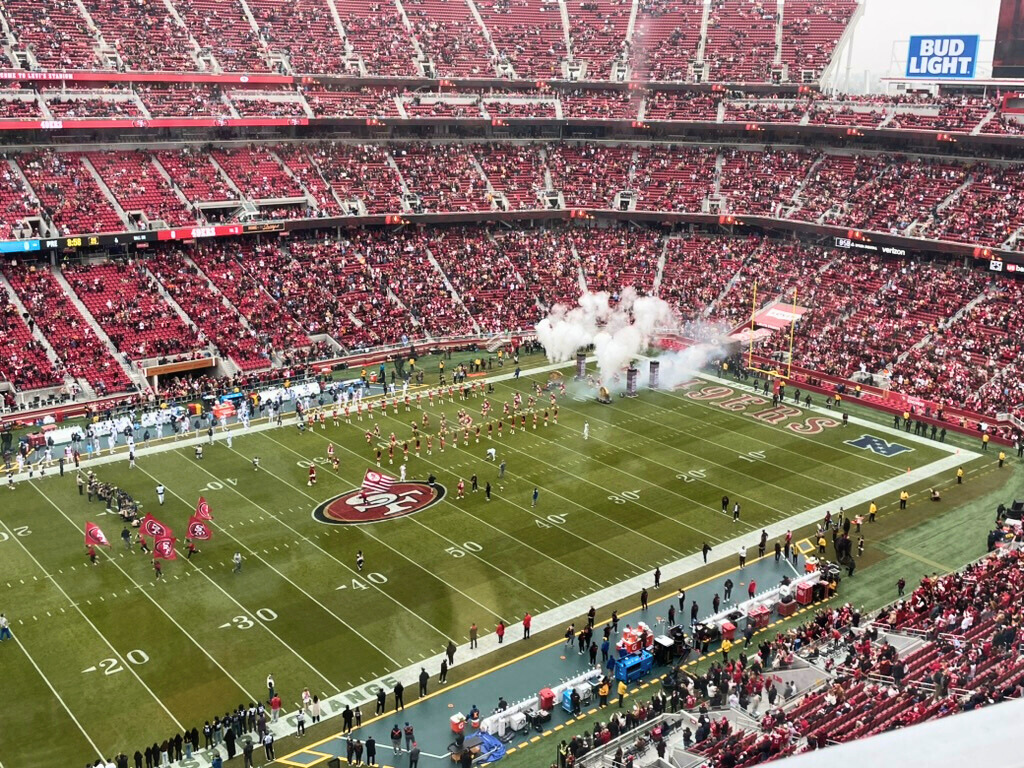 Celebratory smoke billows as the San Francisco 49ers run out onto the field to begin their football game against the Tennessee Titans on Dec. 14, 2025.