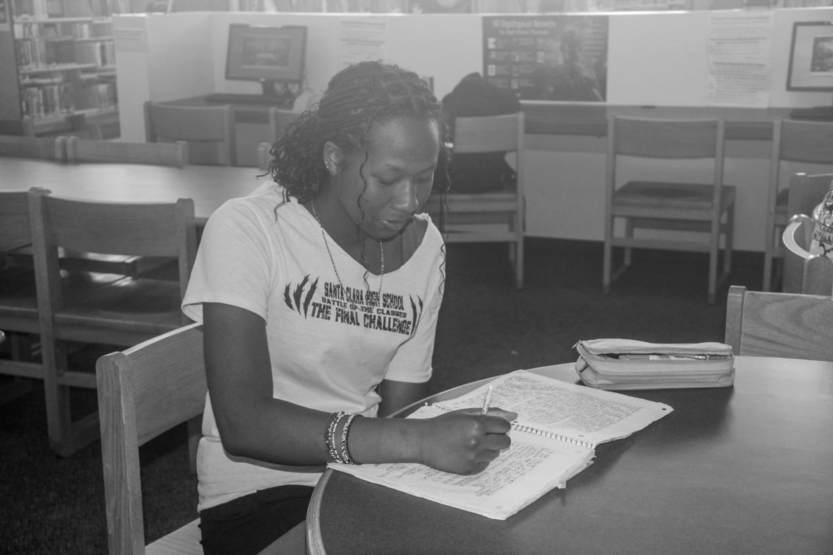 After learning about different kinds of memorization tools through
socials, sophomore Bintu Deen works on taking notes for class.